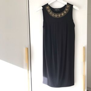 𝅺black dress with brass embellishments